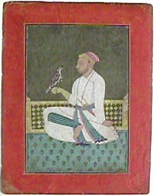A Pahari raja seated on a terrace holding a hawk by Unknown artist